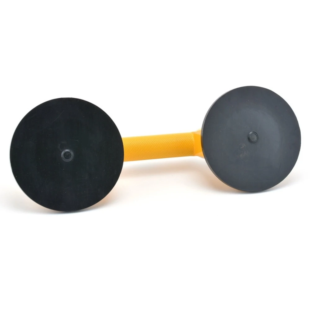 Uso de ventosa doble para quitar abolladuras en coche